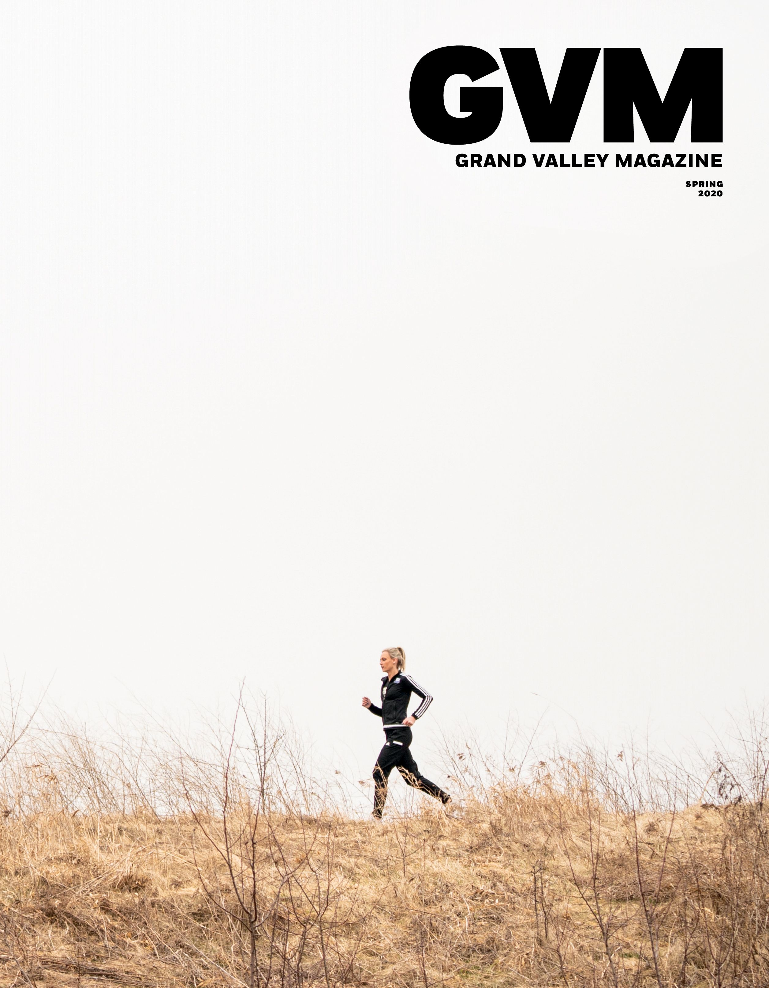 lower 3rd of the image is a women running with dead grass below her, the other 2/3rds is white background/cloudy sky.
