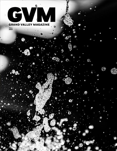 A mainly black cover of the GVM with an abstract image of water splashing.