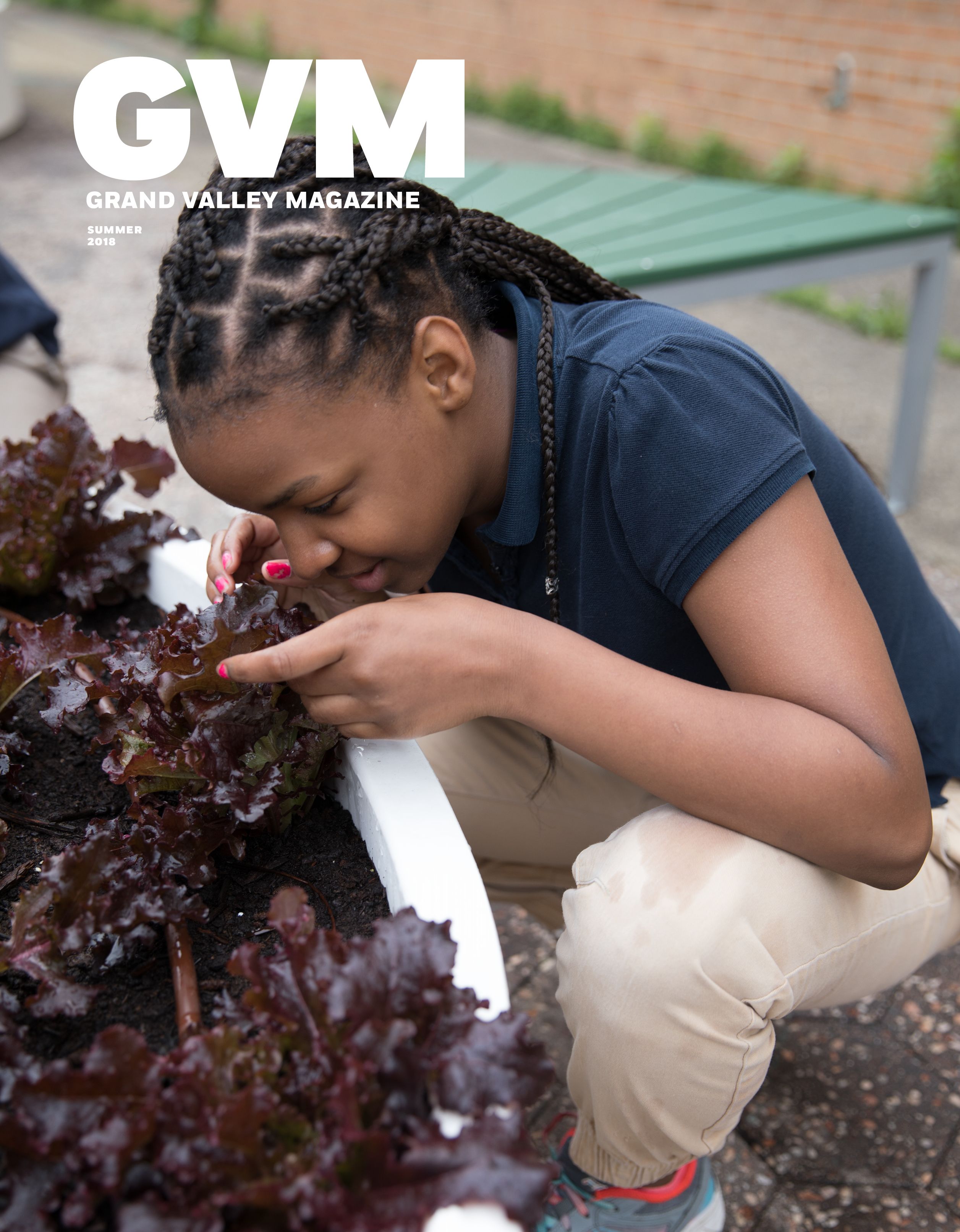a black girl hunched over a planter pot of possibly purple kale.
