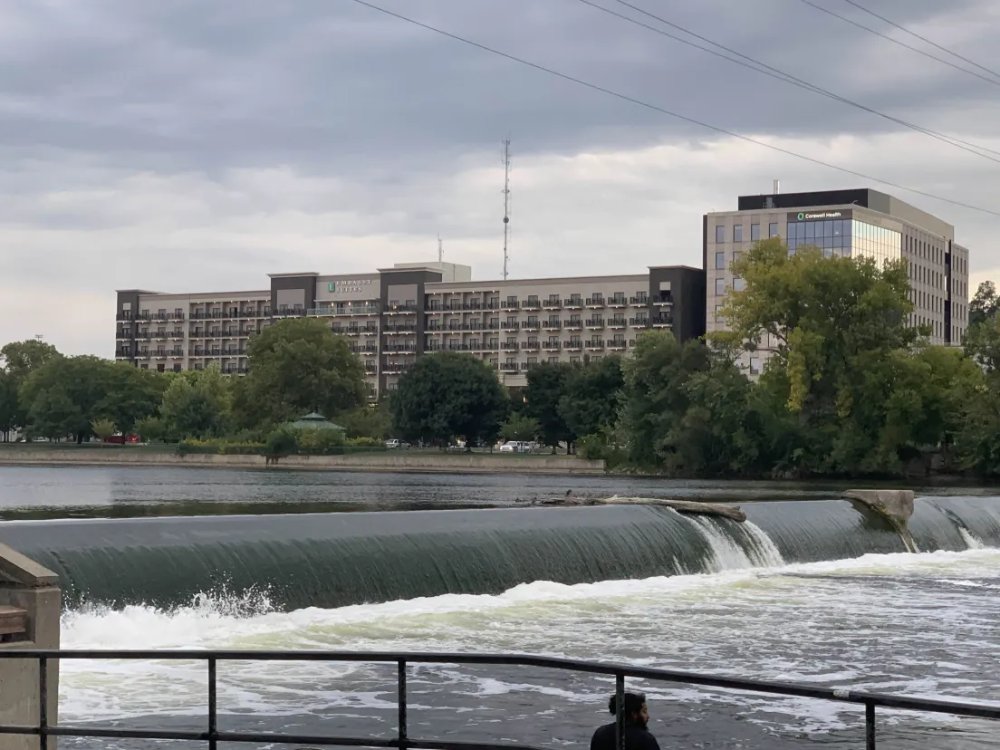 a photo from across the river from the 6th street park.