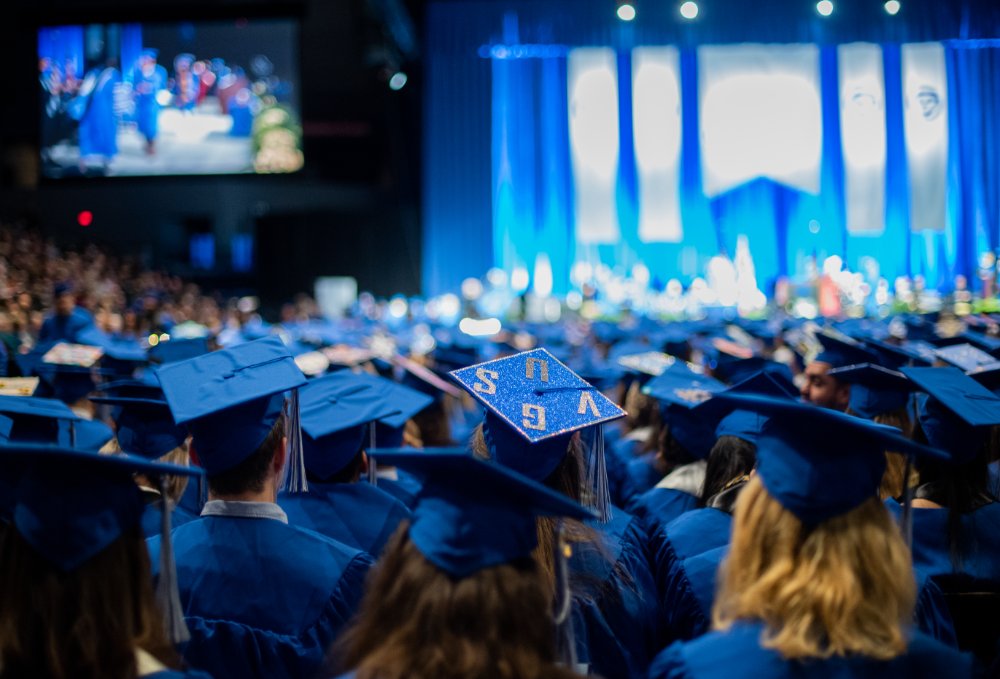 Graduates wearing blue caps and gowns