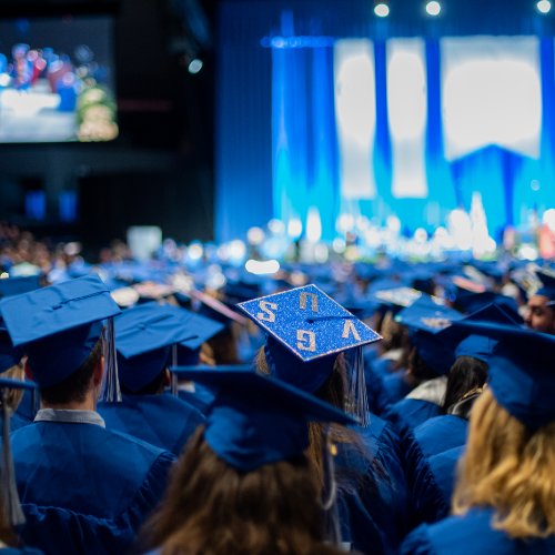 Graduates wearing blue caps and gowns