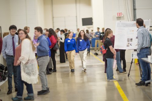 Visiting students walk through the Shape Corp. Innovation Design Center.