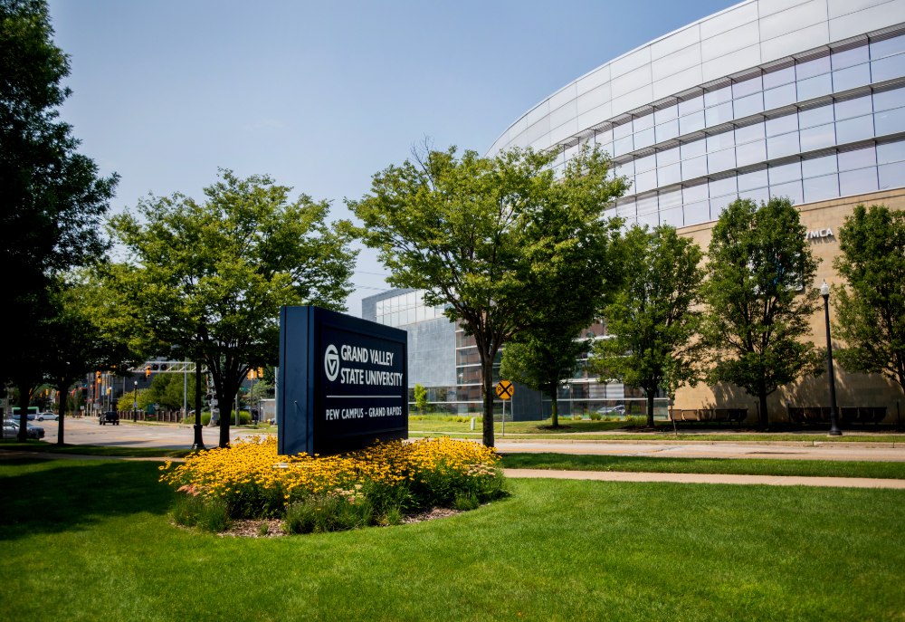 David D. Hunting YMCA visible in background, across street from GVSU Pew Grand Rapids signage