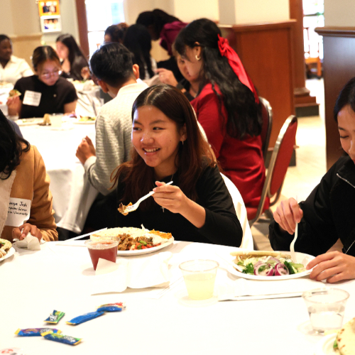 students eating at round table in DeVos Center