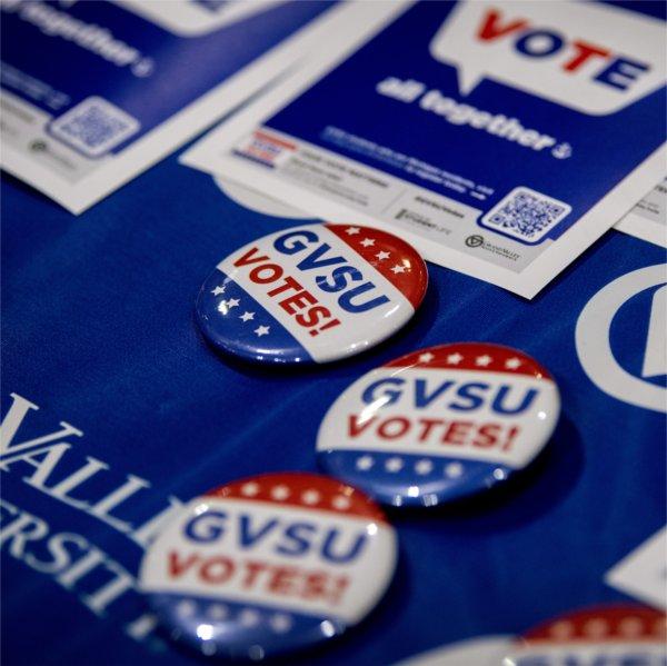 Closeup photo of buttons reading, 'GVSU Votes!'