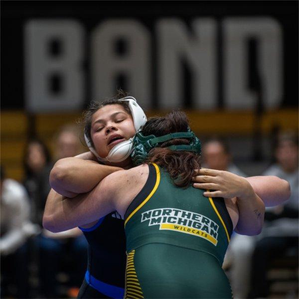 Sabrina Nauss grapples with an opponent from Northern Michigan