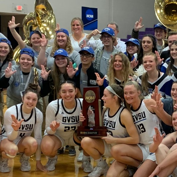 Grand Valley women's basketball team poses with regional championship trophy.