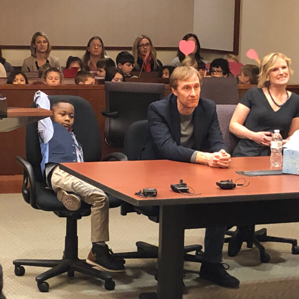 Michael, David Eaton and Andrea Melvin during the adoption hearing.