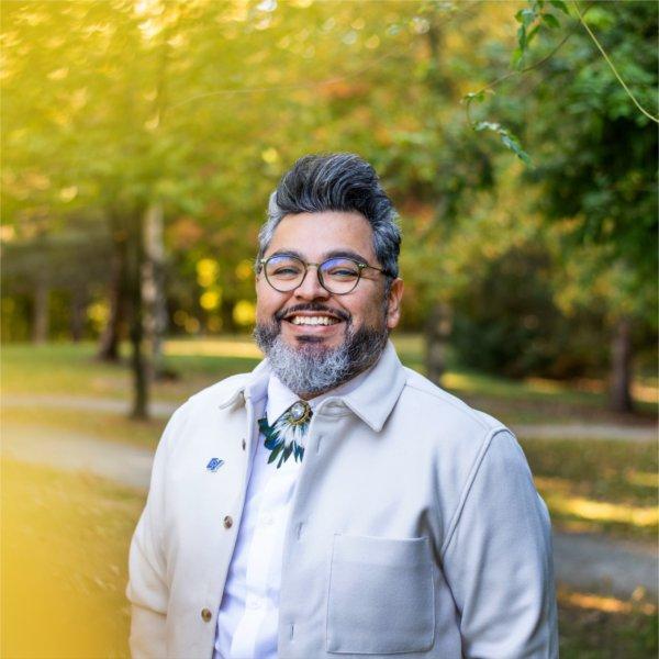 Tiburcio Lince, director of Grand Valley's Office of Multicultural Affairs, poses outside for a photo.