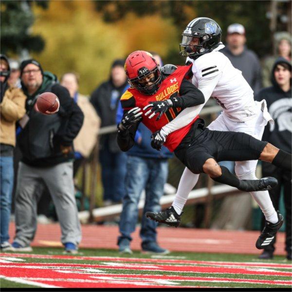 A GVSU defender deflects a pass away from a Ferris State player