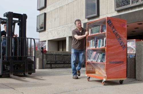 Thousand of books travel from Zumberge Library to the new Mary Idema Pew Library Learning and Information Commons.