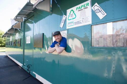 Assistant professor Nick Baine looks out from the recycling center window in Hastings Township.
