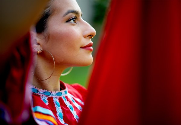 Student Giselle Torres dances with members of Monarcas.