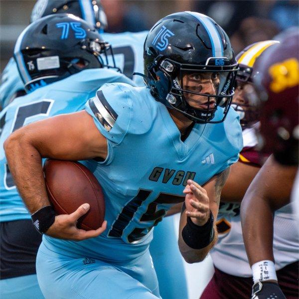 GVSU quarterback Avery Moore runs with the ball against Central State.