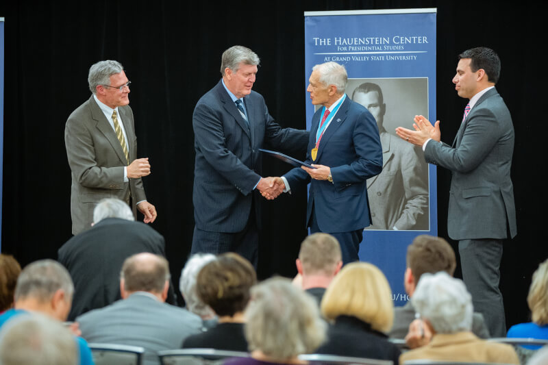 Gen. Wesley Clark (ret.), second from right, receives the Hauenstein Fellowship Medal from President Thomas J. Haas, second from left; Hauenstein Center director Gleaves Whitney, left; and Board of Trustees member Victor Cardenas, right.
