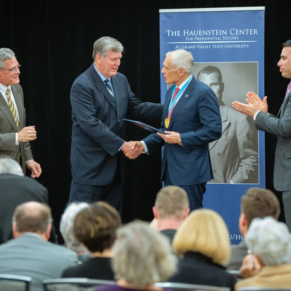 Gen. Wesley Clark (ret.), second from right, receives the Hauenstein Fellowship Medal from President Thomas J. Haas, second from left; Hauenstein Center director Gleaves Whitney, left; and Board of Trustees member Victor Cardenas, right.