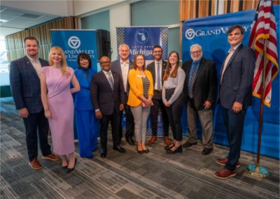 Chief Growth Officer Hilary Doe, President Philomena V. Mantella and Vice President for Enrollment Development and Educational Outreach B. Donta Truss pose for a photo with another recipients of the Make MI Home grant.