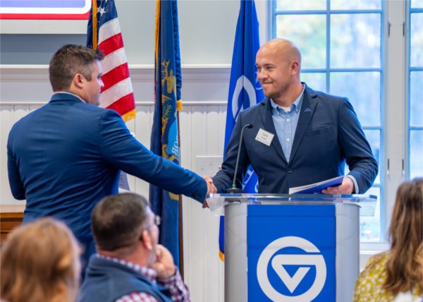 Shane Scherer shakes hands with student veteran Caleb Worpel