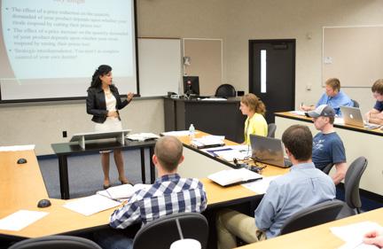 Sonia Dalmia, professor of economics, leads a class. A recent survey of first-generation students found that most felt they had quality relationships with faculty members.