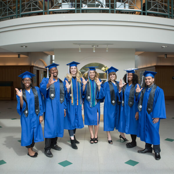 Several of the students in the McNair Scholars program pose for a photo in the student services building.