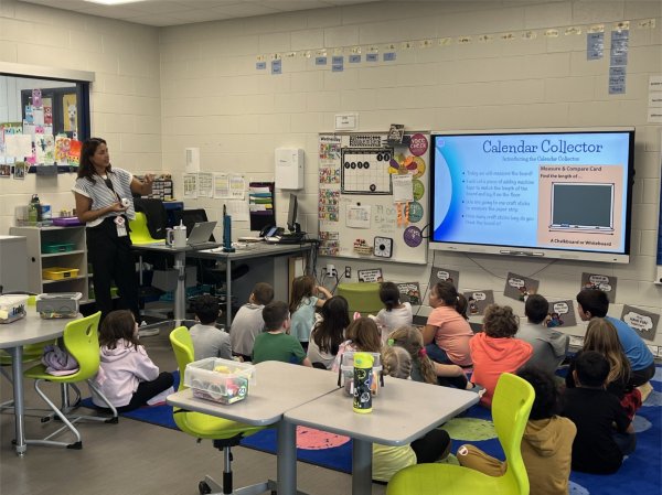 Mikayla Durham, who spent the fall semester as a student teacher, discusses a lesson in class with her students. 