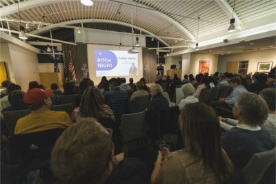 Entrepreneurs make their pitch before an audience of judges, family and friends at the Muskegon Innovation Hub's ElevateWest Accelerator program.