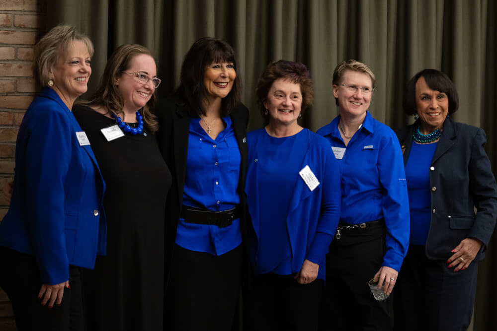 group of women in Laker blue w. President Mantella