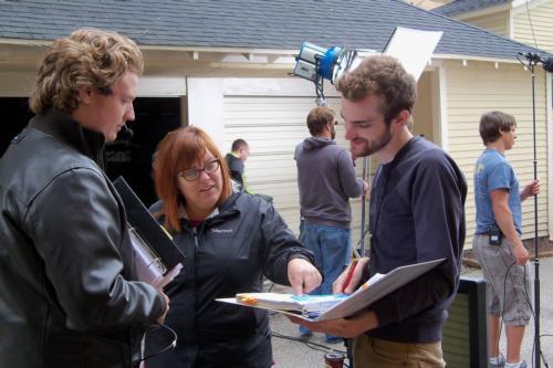 Summer Film Project Director Marie Ullrich, center, works with student crew members, 1st Assistant Director Jeff Butler, and Script Supervisor Mitchell Scheiber. 