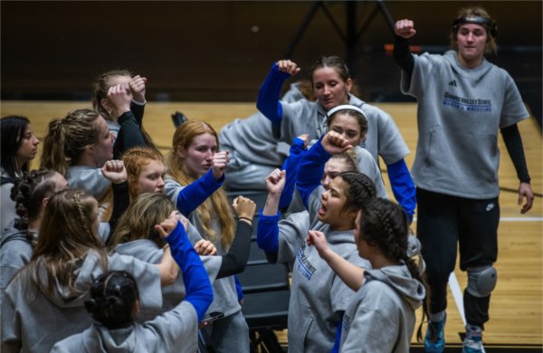 The women's wrestling team congregates to pump each other up in between matches of its inaugural dual meet against Northern Michigan.