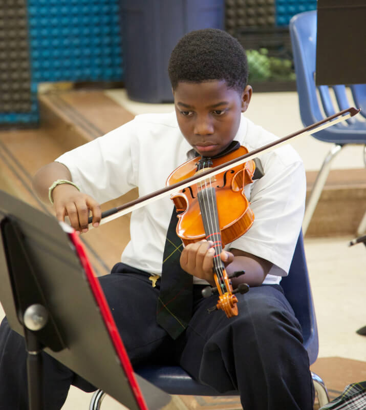 A student plays violin at Washington-Parks Academy.