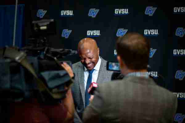 Cornell Mann jokes with reporters following the news conference where he was welcomed as the sixth men's basketball coach in the Grand Valley history.