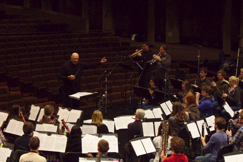 Lowell Graham, retired U.S. Air Force Band commander, conducts the ensemble on select tracks. Photo by Nate Bliton.