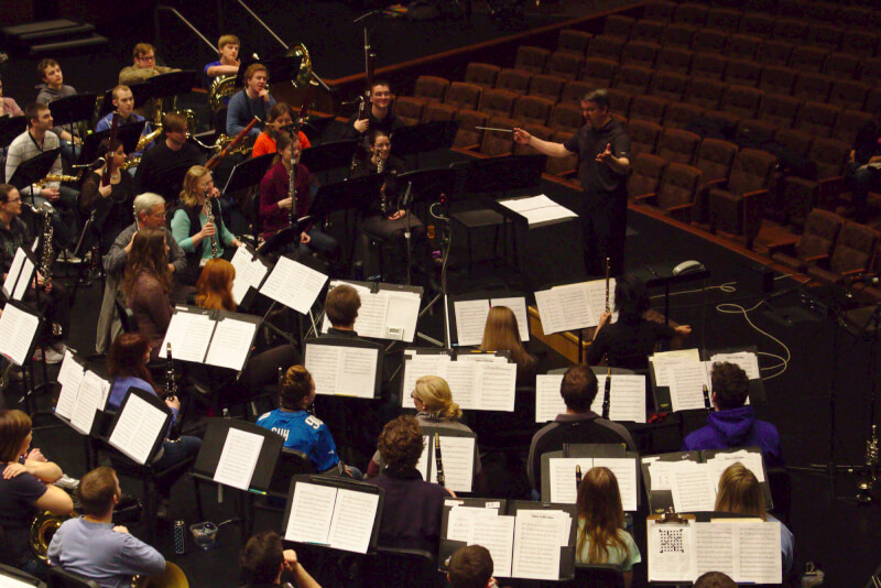 Kevin Tutt, professor of music, conducts the Symphonic Wind Ensemble. Photo by Nate Bliton.