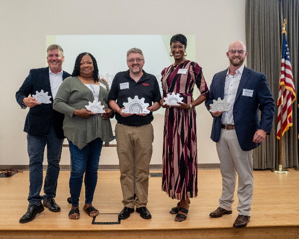 (From left) 2024 Lakeshore Innovator of the Year award finalists Jim Rudicil, executive director of Muskegon Luge Adventure Sports Park; Corine Rose, owner of Corine's Cakes and Catering; Michael Gerstweiler, owner of Pribusin Inc.; Kaja Thornton, owner of Cajun Cuisine By Us; and Dakoyta Greenman, owner of Westwood AI; are pictured at the Muskegon Innovation Hub on July 25. Gerstweiler won the award.