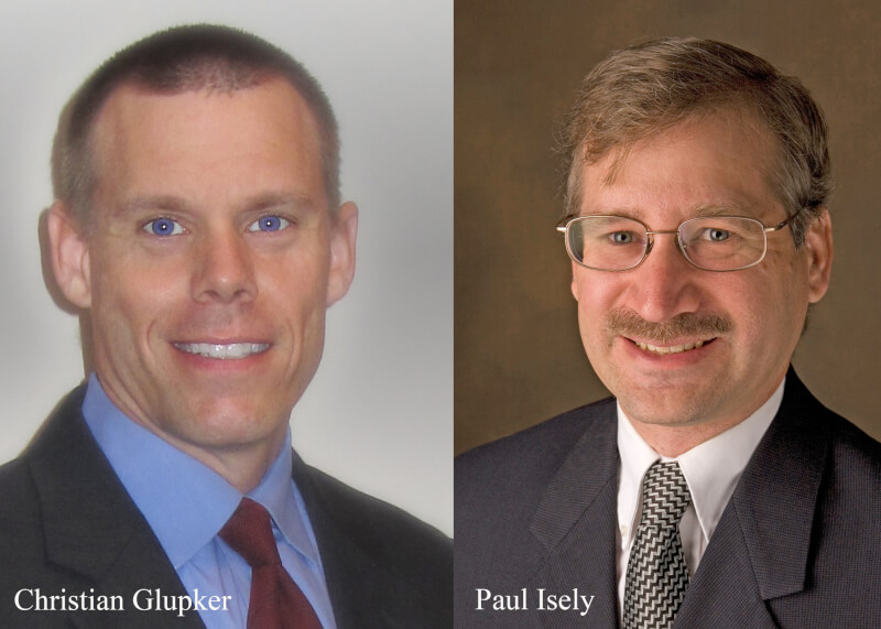 Christian Glupker, clinical affiliate professor of economics, and Paul Isely, professor and associate dean of economics.