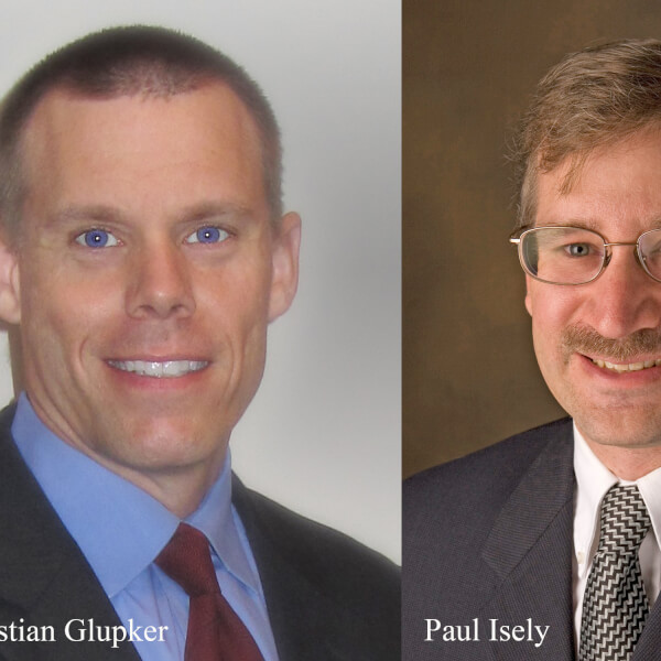Christian Glupker, clinical affiliate professor of economics, and Paul Isely, professor and associate dean of economics.