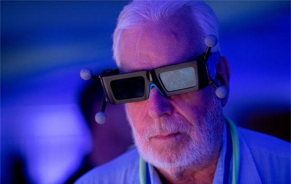 Clarke Borgeson tries on stereoscopic 3D glasses to view a rendering at The Blue Dot Experience during Tech Week September 19.