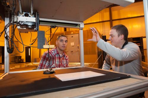 Electrical engineering students Calvin Preston and Matt Amidon at the Electromagnetic Compatibility Center (EMC).