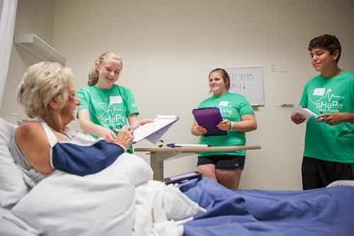 Students participating in simulation exercises with a patient. Photo by Jess Weal.