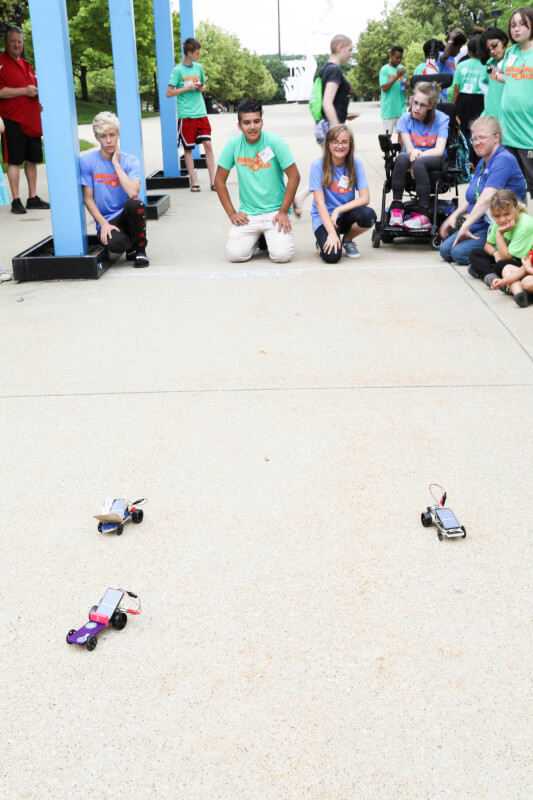Campers racing their solar-powered cars.