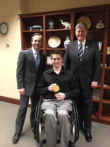 From left are Lt. Gov. Brian Calley, Garrett Goodwin and President Thomas J. Haas.