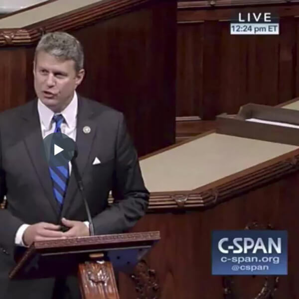 Rep. Bill Huizenga stands behind a podium in congress.