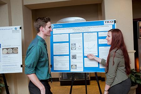 McNair Scholar Brittany Sincox, right, at her poster presentation
