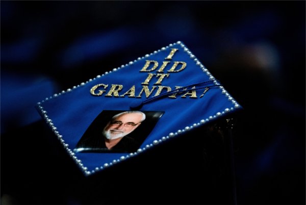 The top of a graduation cap that reads "I did it Grandpa!"