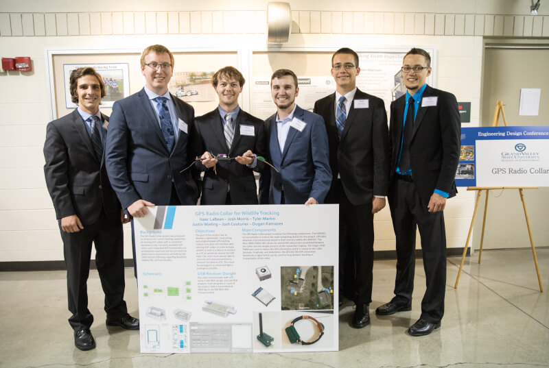  Six students standing behind a poster board presentation