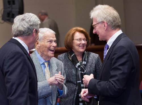 Ralph Hauenstein, second from left, laughs with Hank Meijer, right, after Meijer's afternoon keynote address.