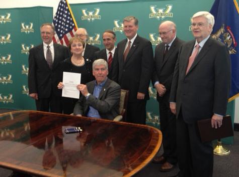 President Haas, third from right, at governor's signing of capital outlay bill.