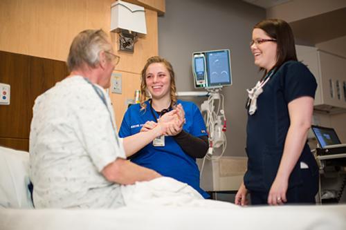 Allyson Stokosa, center, is pictured at Holland Hospital, where she is completing a clinical rotation with her preceptor, Meggan Hefferan.