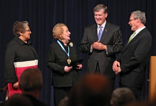 Secretary Albright receives the Hauenstein Fellowship Medal from Shelley Padnos, President Thomas J. Haas, and Gleaves Whitney.